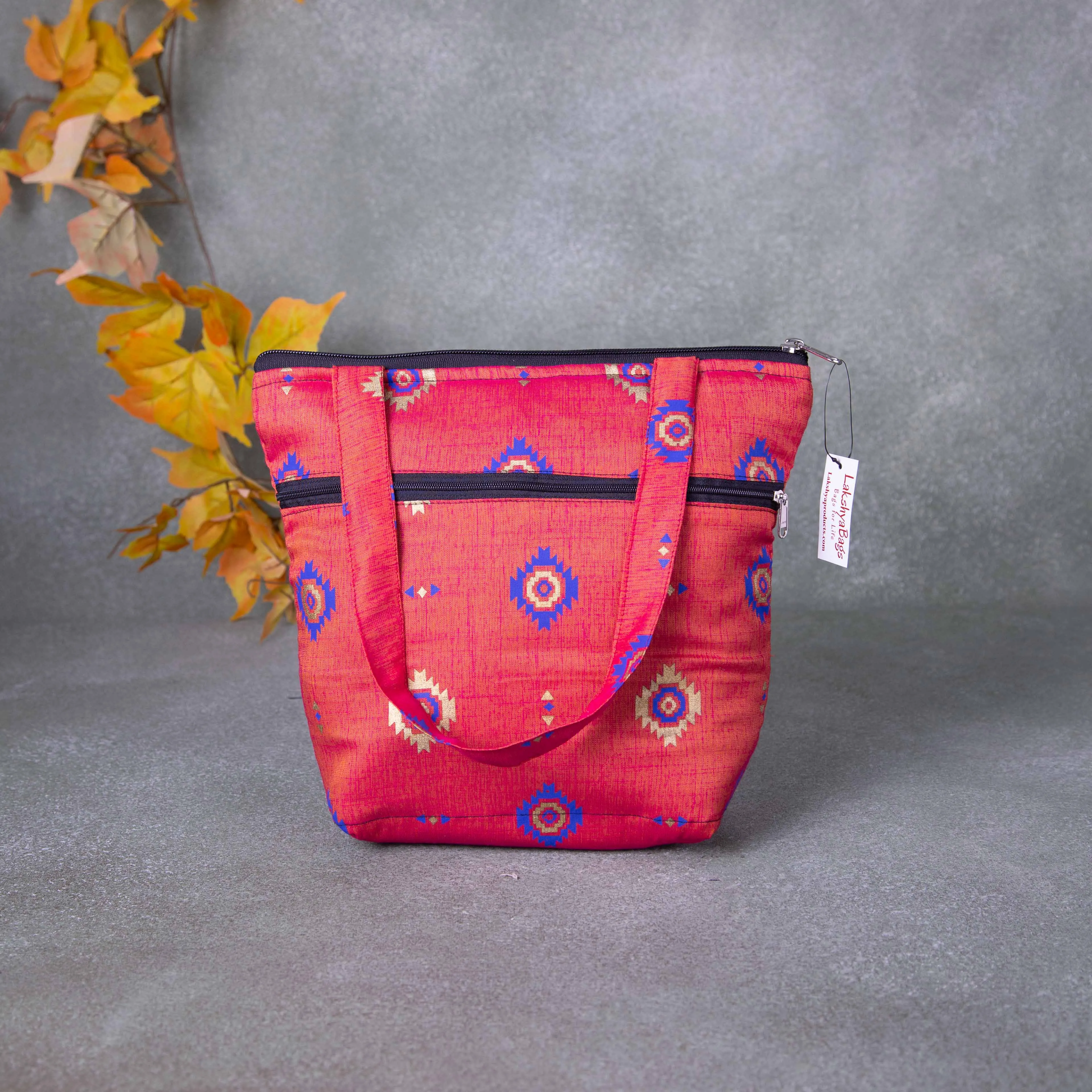 Small Handbag orange colour with Blue Flower Design